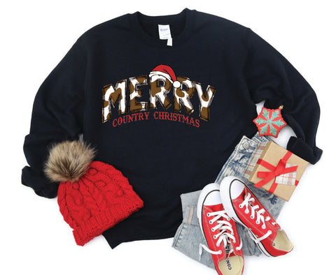 Merry Country Christmas crewneck with brown cow spots in the "Merry" text, perfect for adding a rustic, country-inspired touch to holiday attire.
